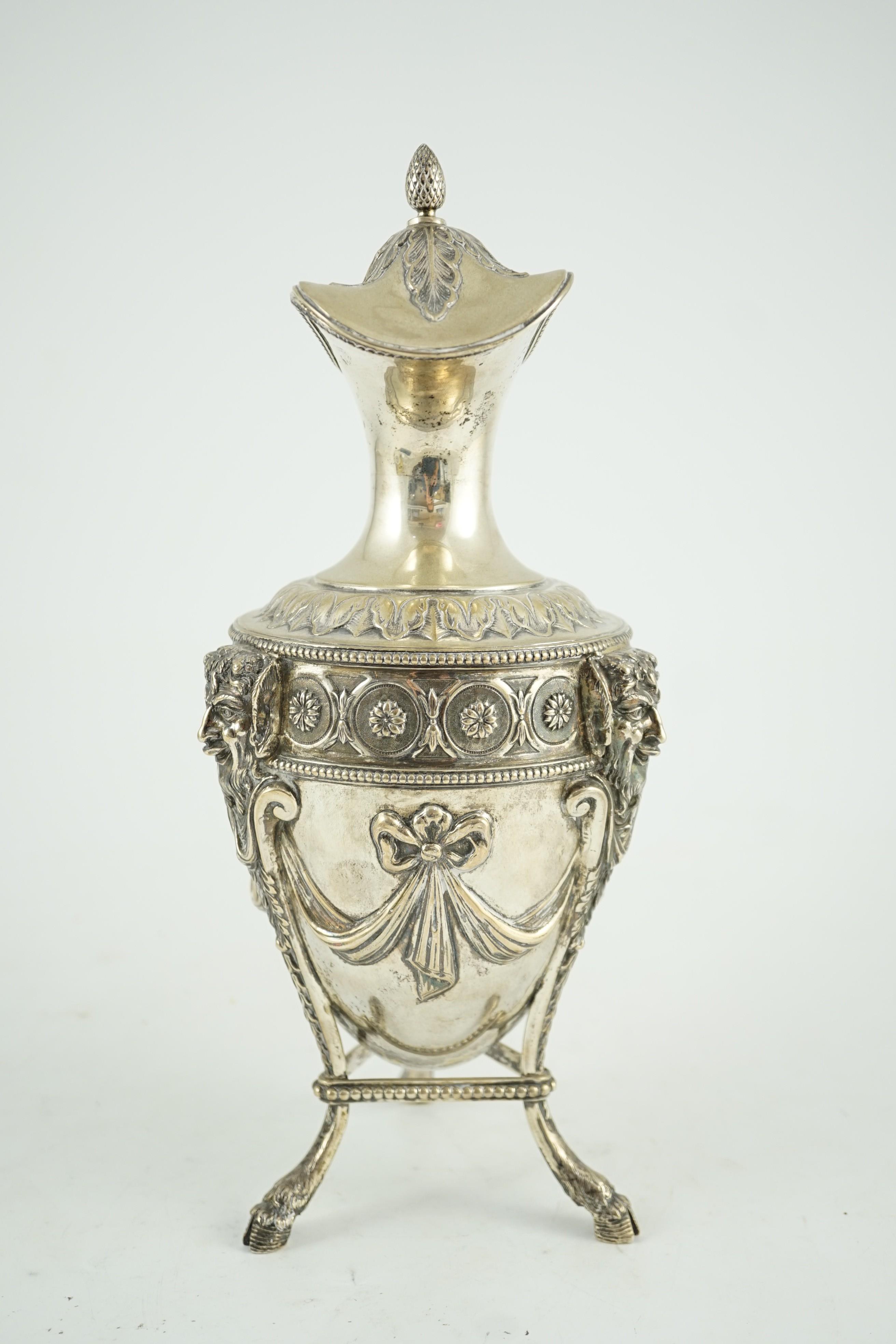 An 18th century French silver vase shaped claret jug